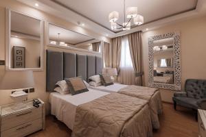 Ένα ή περισσότερα κρεβάτια σε δωμάτιο στο Osborne Hotel