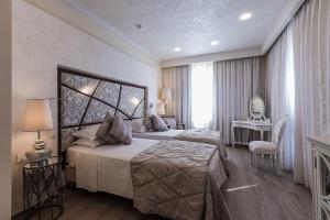 Ένα ή περισσότερα κρεβάτια σε δωμάτιο στο Osborne Hotel