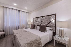 Ένα ή περισσότερα κρεβάτια σε δωμάτιο στο Osborne Hotel