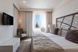 Ένα ή περισσότερα κρεβάτια σε δωμάτιο στο Osborne Hotel