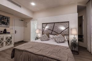 Ένα ή περισσότερα κρεβάτια σε δωμάτιο στο Osborne Hotel