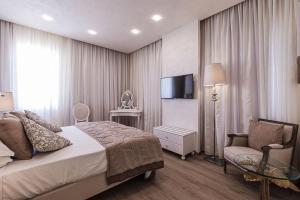Ένα ή περισσότερα κρεβάτια σε δωμάτιο στο Osborne Hotel