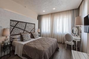 Ένα ή περισσότερα κρεβάτια σε δωμάτιο στο Osborne Hotel