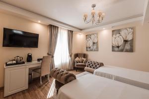 Ένα ή περισσότερα κρεβάτια σε δωμάτιο στο Osborne Hotel