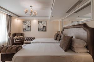 Ένα ή περισσότερα κρεβάτια σε δωμάτιο στο Osborne Hotel