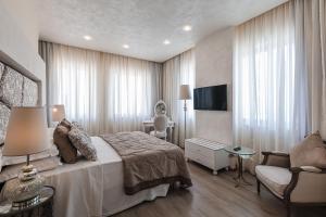 Ένα ή περισσότερα κρεβάτια σε δωμάτιο στο Osborne Hotel