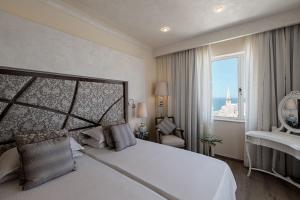 Ένα ή περισσότερα κρεβάτια σε δωμάτιο στο Osborne Hotel