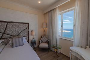 Ένα ή περισσότερα κρεβάτια σε δωμάτιο στο Osborne Hotel