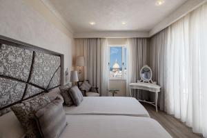 Ένα ή περισσότερα κρεβάτια σε δωμάτιο στο Osborne Hotel