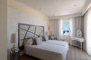 Ένα ή περισσότερα κρεβάτια σε δωμάτιο στο Osborne Hotel