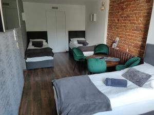 Posteľ alebo postele v izbe v ubytovaní Apartament Studio 11 Starówka Konin
