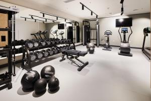 a gym with dumbbells and weights on the floor at Apartments Park Plava Laguna in Poreč