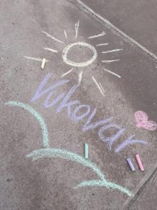 a sun drawn on the ground with chalk on the street at Lavanda in Vukovar