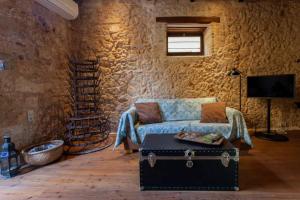 a living room with a couch and a trunk at History and Charm in Chania Town