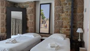 Cama ou camas em um quarto em Hotel De L'Europe