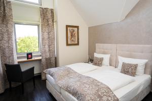 Postel nebo postele na pokoji v ubytování Hotel Volapük