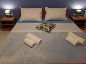 Postel nebo postele na pokoji v ubytování APARTAMENTOS AROMA