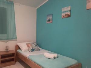 Postel nebo postele na pokoji v ubytování APARTAMENTOS AROMA