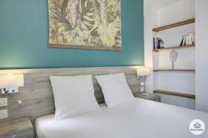 Una cama o camas en una habitación de T3- Infini bleu 4 étoiles - 63 m2 - vue océan - St-Gilles 32 fotos más