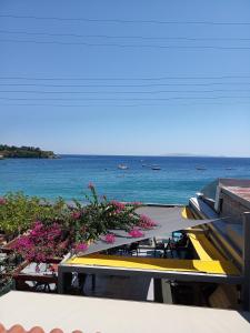 a view of the ocean from the balcony of a building at Buganvilla Sea View apts in Agia Pelagia