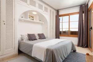 En eller flere senge i et værelse på Apartamento Lortal + 23 billeder