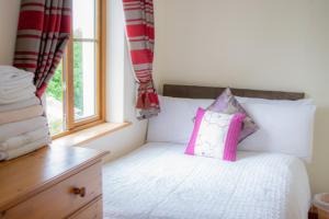 Giường trong phòng chung tại no 6 Cnoc Na Si