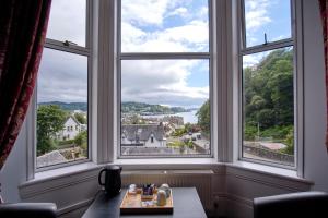 a living room filled with furniture and a window at Argyll House in Oban