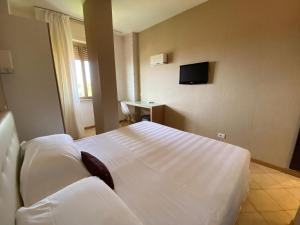 Postel nebo postele na pokoji v ubytování Hotel Joseph