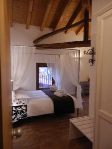 Postel nebo postele na pokoji v ubytování Agriturismo Cjargnei