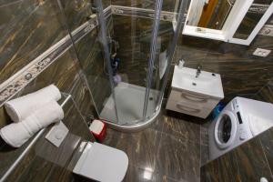 a bathroom with a shower and a toilet and a sink at Apartments Vladimir #3 in Makarska +23 photos