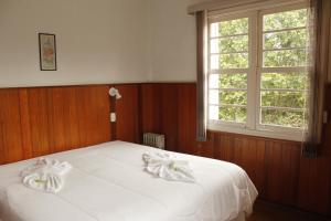 Cama ou camas em um quarto em Hotel Casa São José