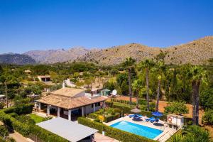 an aerial view of a house with a swimming pool at Pantina in Pollença