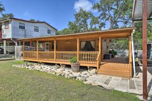 a large wooden house with a large deck at Couples Cabin with Luxury Deck, 1 Mi to Canyon Lake! in Canyon Lake