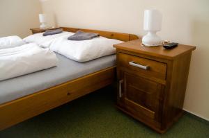 Posteľ alebo postele v izbe v ubytovaní Penzión Na Kopečku