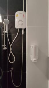 a bathroom with a blow dryer on the wall at Nap at 265 Donmeaung in Bangkok +32 photos