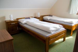 Posteľ alebo postele v izbe v ubytovaní Penzión Na Kopečku