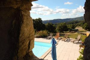 a view of a swimming pool from a window of a house at Rouretord Hirondelle in Gilhac-et-Bruzac +7 photos