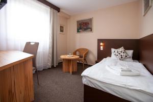 Postel nebo postele na pokoji v ubytování Hotel Stella