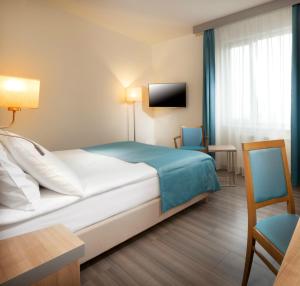 Posteľ alebo postele v izbe v ubytovaní Holiday Inn Prague by IHG