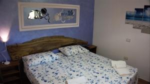 Postel nebo postele na pokoji v ubytování B&B Donna Maja