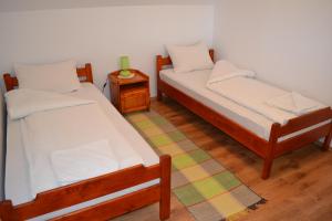 Una cama o camas en una habitación de Margaréta Vendégház