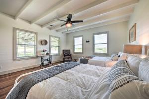 a bedroom with two beds and a ceiling fan at Chic Farmhouse - Wine Tasting and Church Tour! in Schulenburg