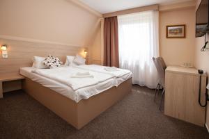 Postel nebo postele na pokoji v ubytování Hotel Stella
