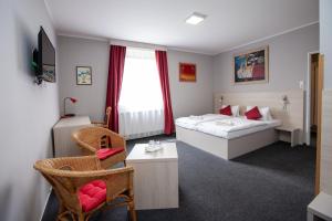 Postel nebo postele na pokoji v ubytování Hotel Stella