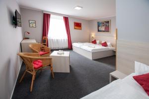 Postel nebo postele na pokoji v ubytování Hotel Stella