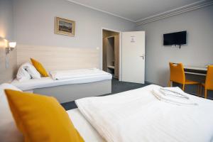 Postel nebo postele na pokoji v ubytování Hotel Stella