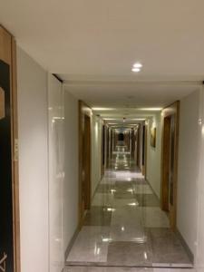 a hallway of a building with a long corridor at Orbi City in Batumi