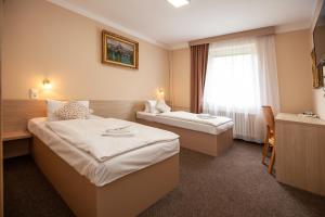Postel nebo postele na pokoji v ubytování Hotel Stella