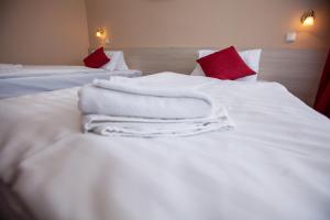 Postel nebo postele na pokoji v ubytování Hotel Stella