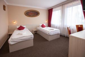 Postel nebo postele na pokoji v ubytování Hotel Stella
